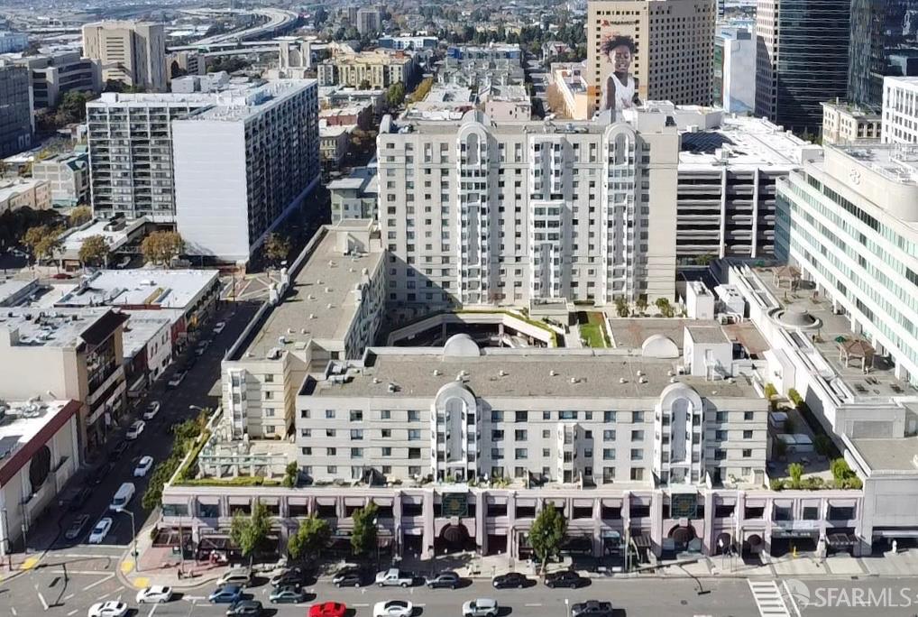a view of large building with streets and trees