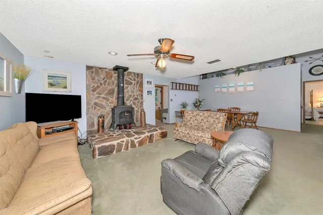 a view of a dining room with furniture and chandelier