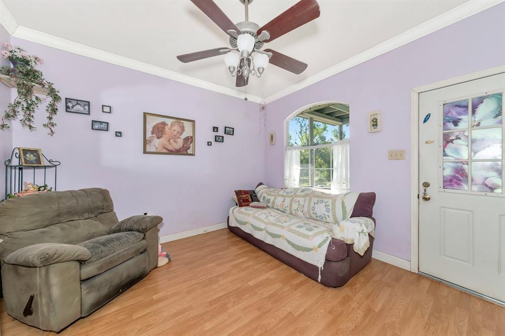 2070 59th Street Sarasota, FL 34243 - Photo 22 of 56 a living room with furniture and a large window