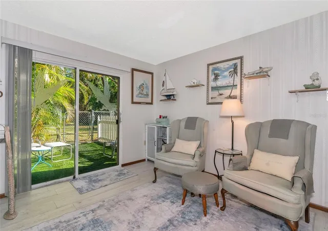 a bedroom with a large bed and a flat screen tv