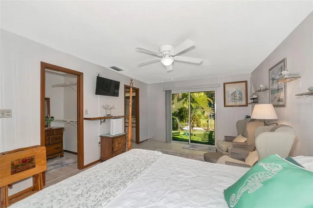 a bathroom with a granite countertop sink a mirror and a toilet