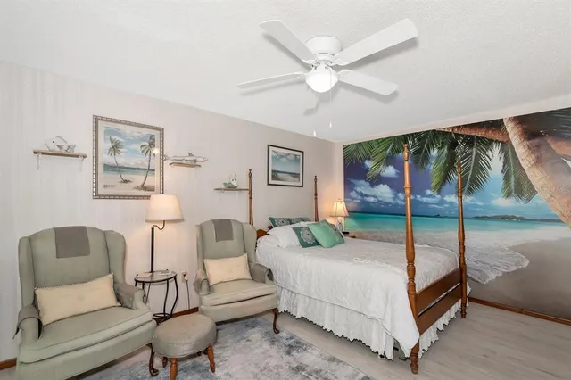 a bathroom with a glass shower door and a sink