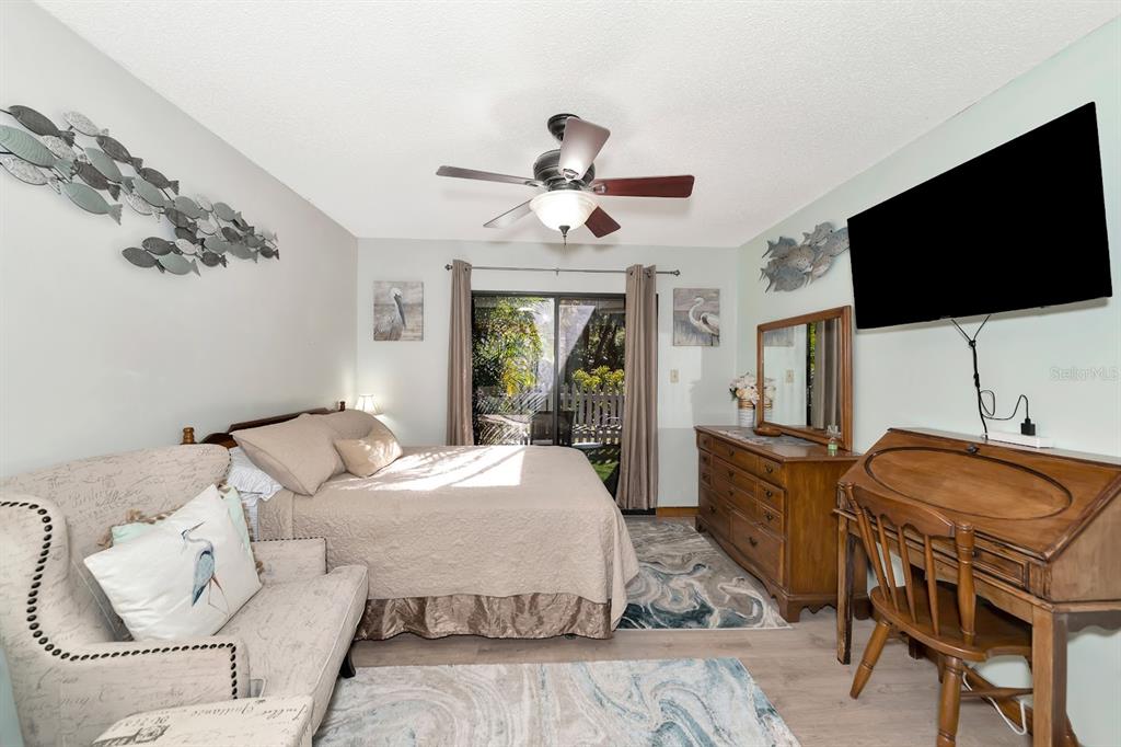 2070 59th Street Sarasota, FL 34243 - Photo 33 of 56 a bedroom with a bed and a flat screen tv