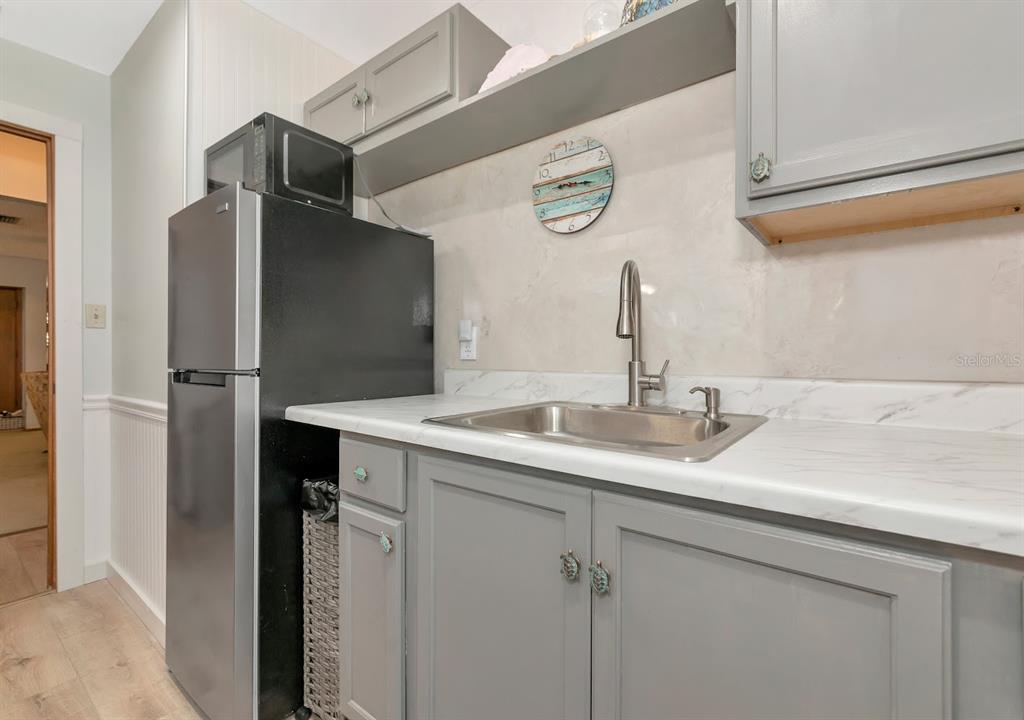 2070 59th Street Sarasota, FL 34243 - Photo 36 of 56 a bathroom with a sink and a mirror