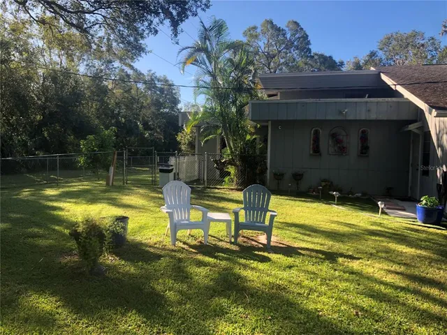 a view of a swimming pool with an outdoor space and seating area