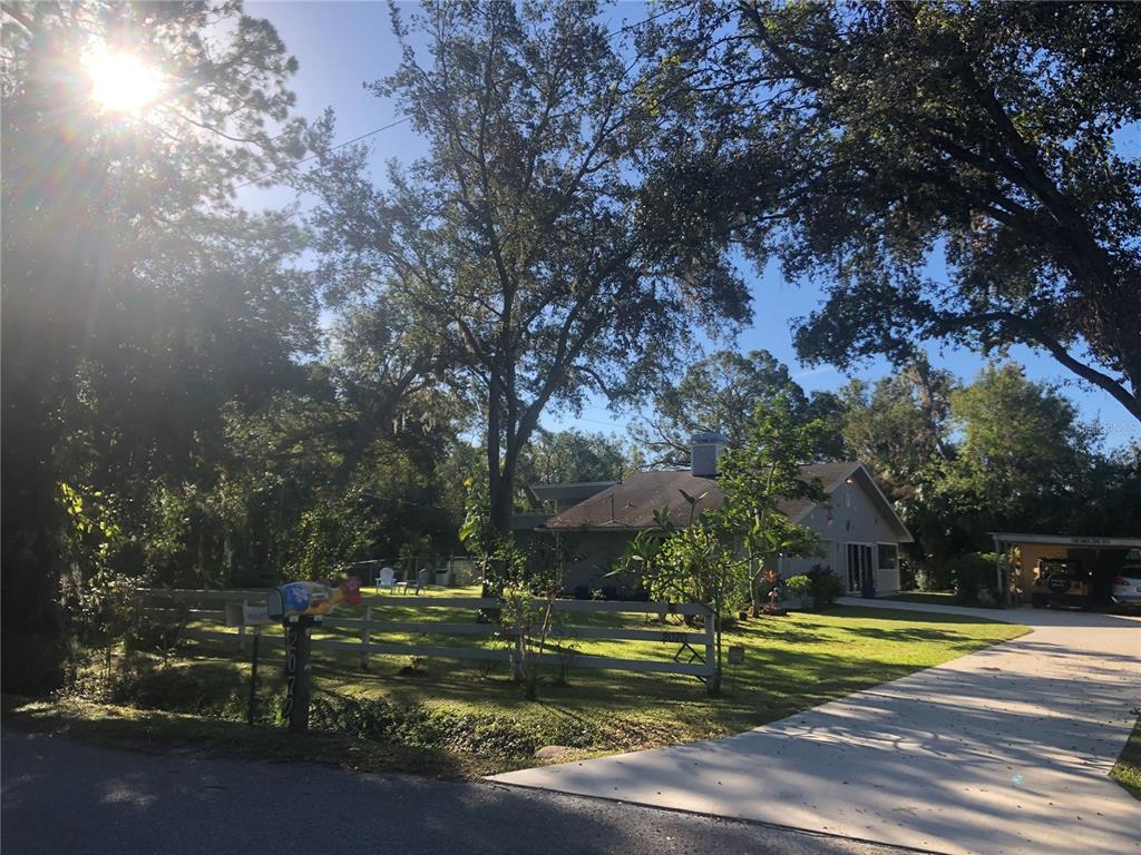 2070 59th Street Sarasota, FL 34243 - Photo 44 of 56 a view of a swimming pool with an outdoor space and seating area