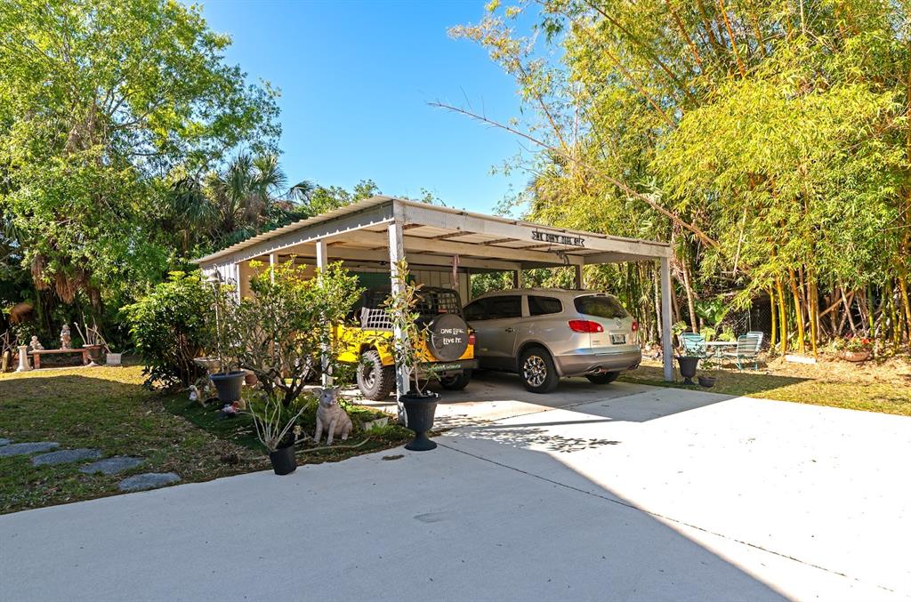 2070 59th Street Sarasota, FL 34243 - Photo 45 of 56 a view of a parked cars in front of house
