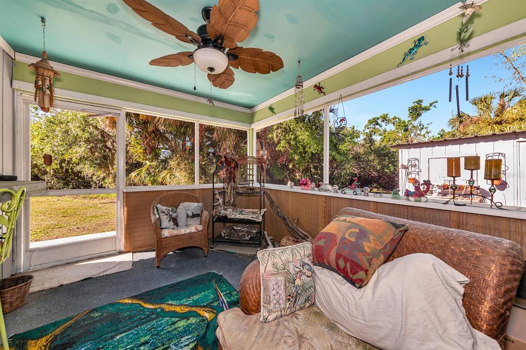 2070 59th Street Sarasota, FL 34243 - Photo 6 of 56 a living room with patio furniture and a large window