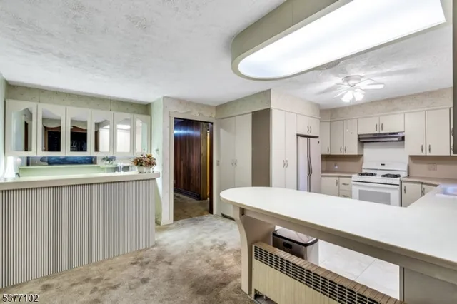 an empty room with windows and entryway