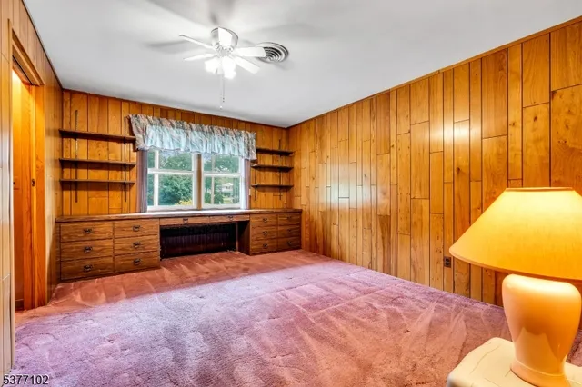 a bathroom with a tub and mirror