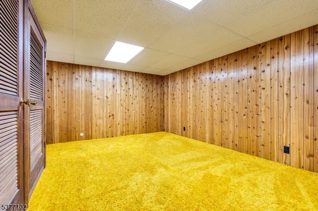 a house that has a tree in front of it