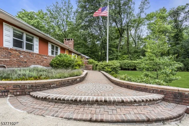 a view of a chair and tables in the garden