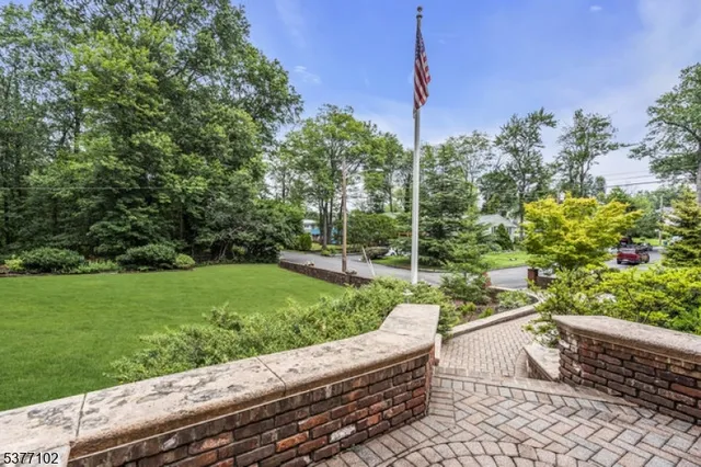 a view of a yard with wooden fence