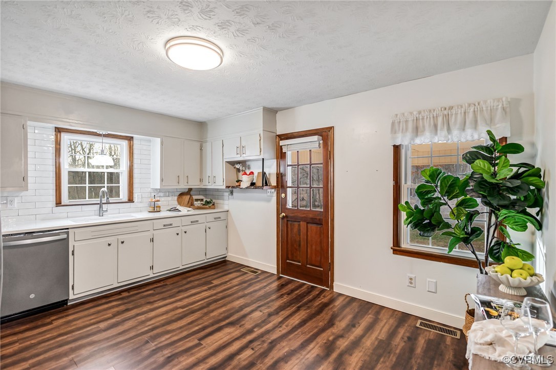 8087 Bell Road Dillwyn, VA 23936 - Photo 13 of 37 a large white kitchen with stainless steel appliances granite countertop a stove a sink a refrigerator white cabinets and wooden floor