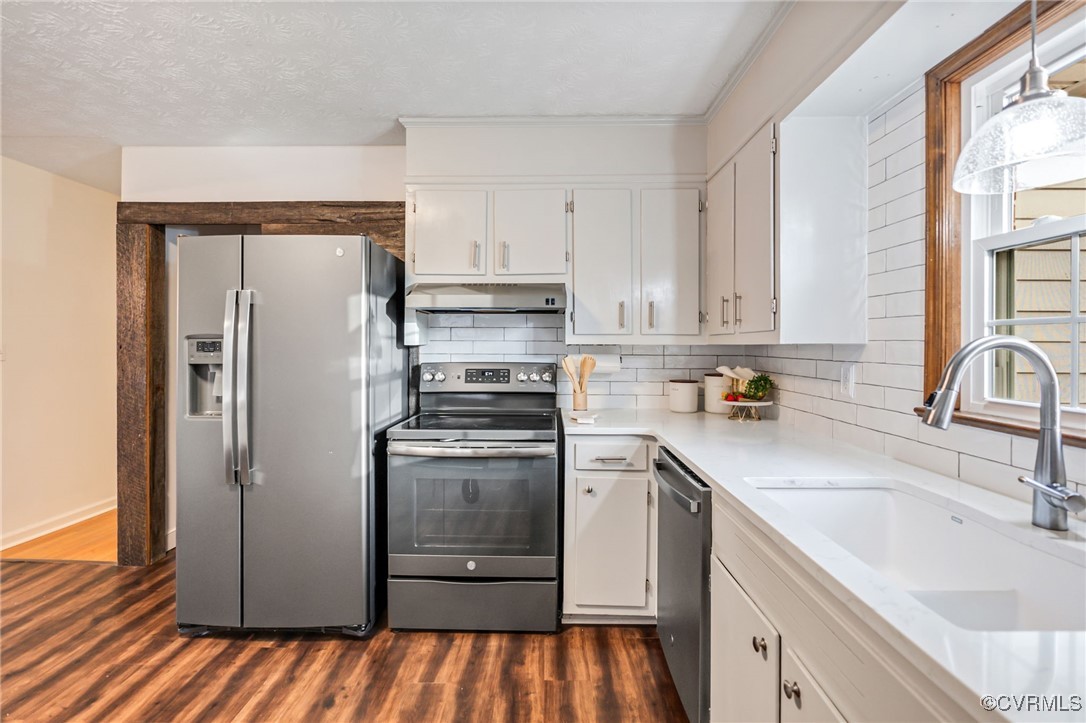 8087 Bell Road Dillwyn, VA 23936 - Photo 14 of 37 a kitchen with a refrigerator sink and cabinets