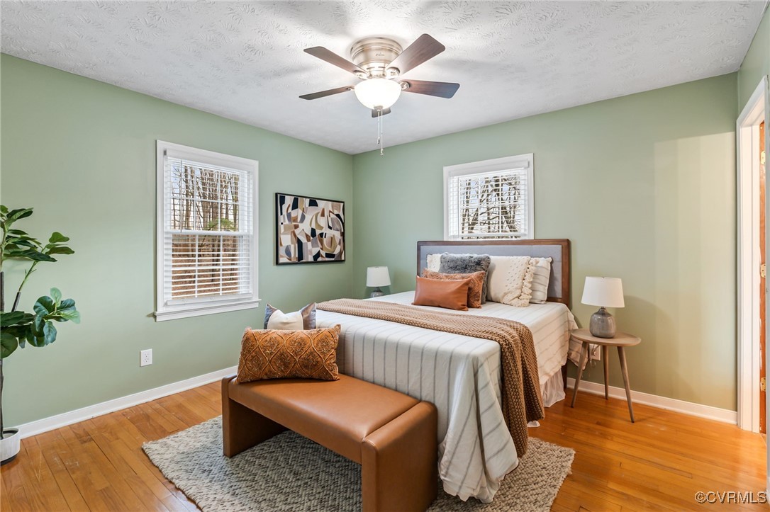 8087 Bell Road Dillwyn, VA 23936 - Photo 18 of 37 a bedroom with a bed and wooden floor
