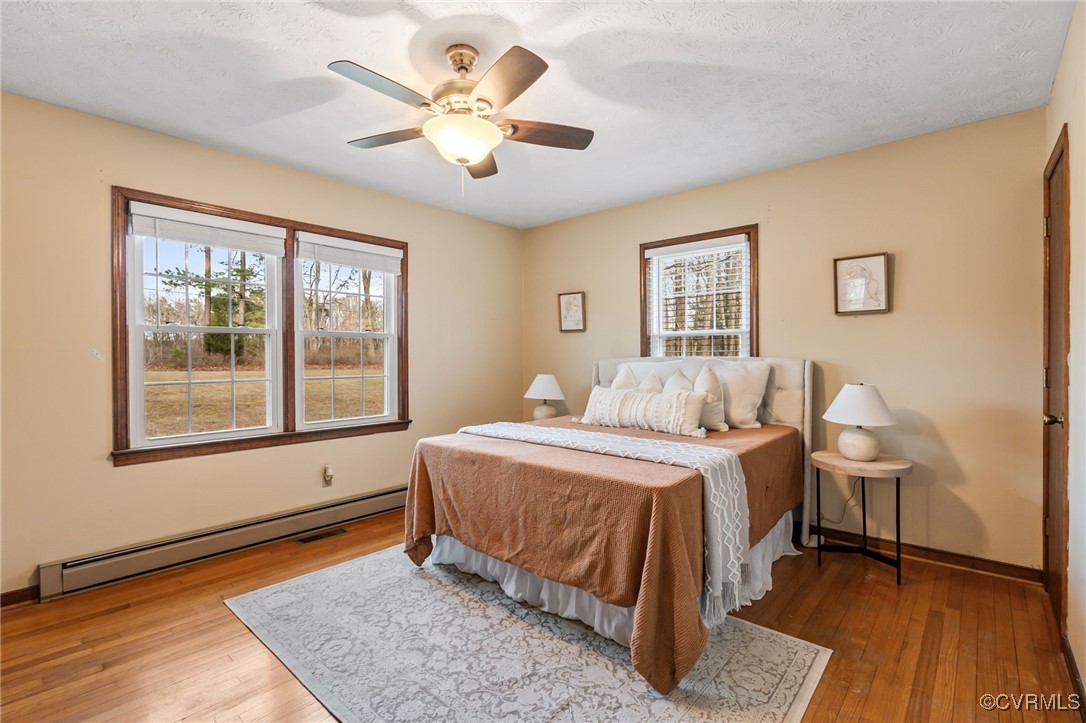 8087 Bell Road Dillwyn, VA 23936 - Photo 20 of 37 a spacious bedroom with a bed and a window