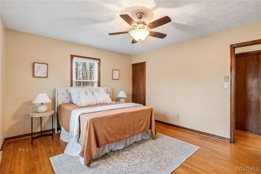 8087 Bell Road Dillwyn, VA 23936 - Photo 21 of 37 a bedroom with a bed and a wooden floor