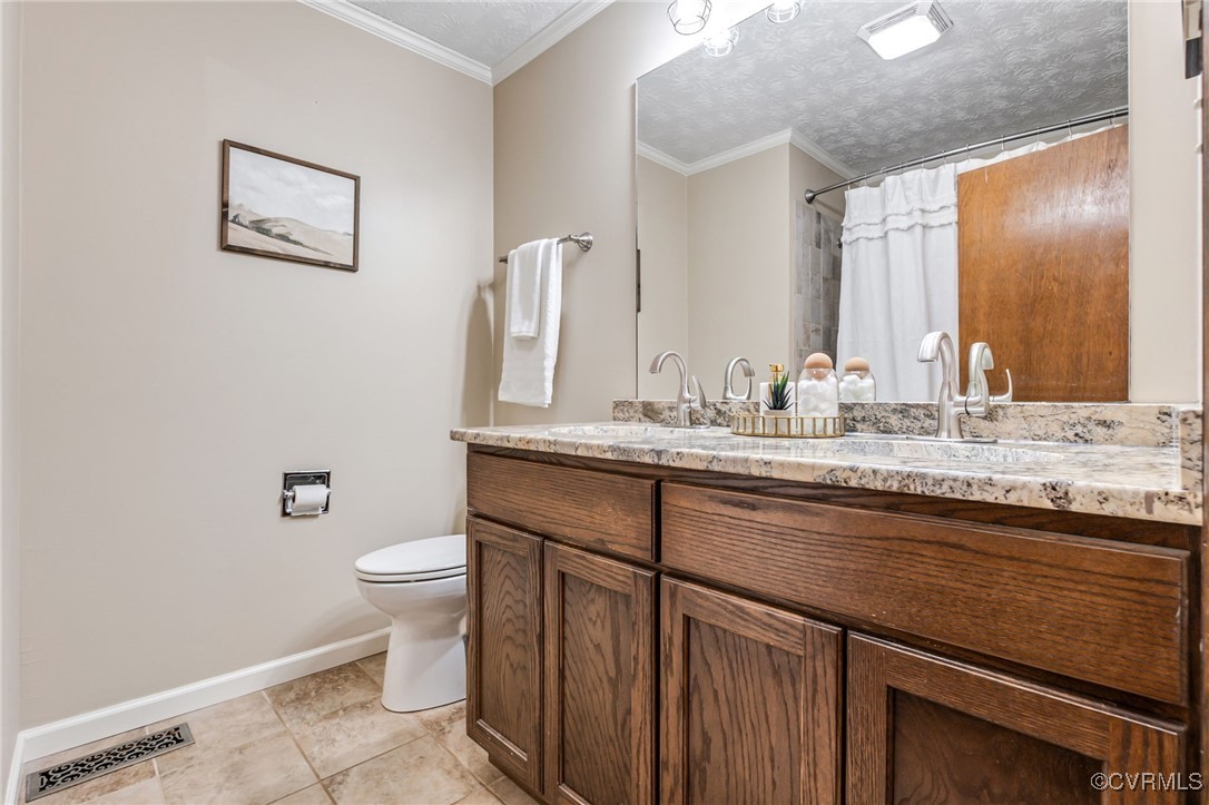 8087 Bell Road Dillwyn, VA 23936 - Photo 23 of 37 a bathroom with a sink a toilet and mirror