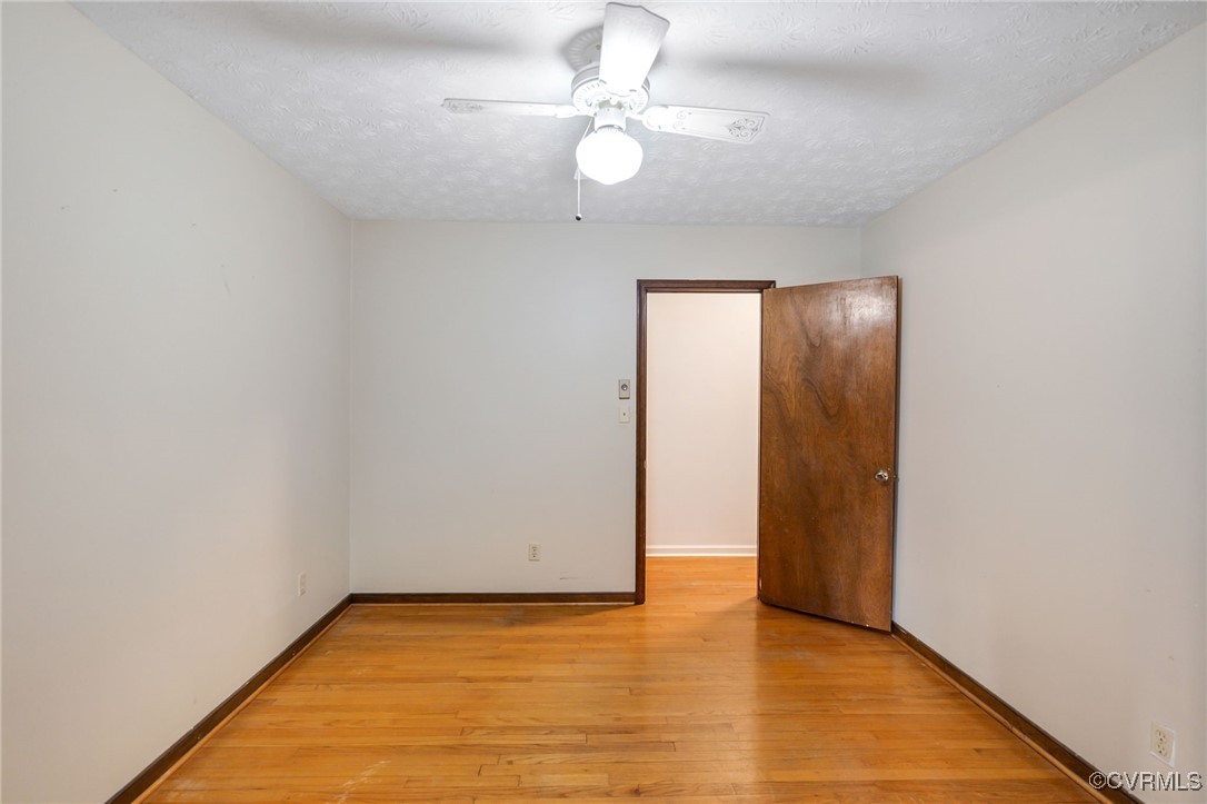 8087 Bell Road Dillwyn, VA 23936 - Photo 24 of 37 a view of an empty room with window and wooden floor