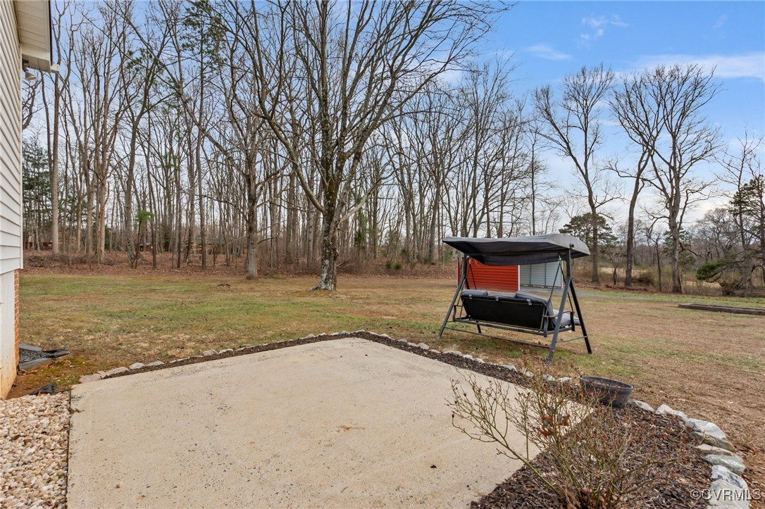 8087 Bell Road Dillwyn, VA 23936 - Photo 35 of 37 a bench sitting in middle of a yard