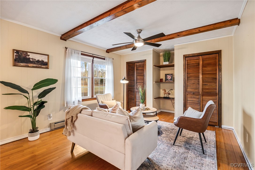 8087 Bell Road Dillwyn, VA 23936 - Photo 7 of 37 a living room with furniture a table and wooden floor