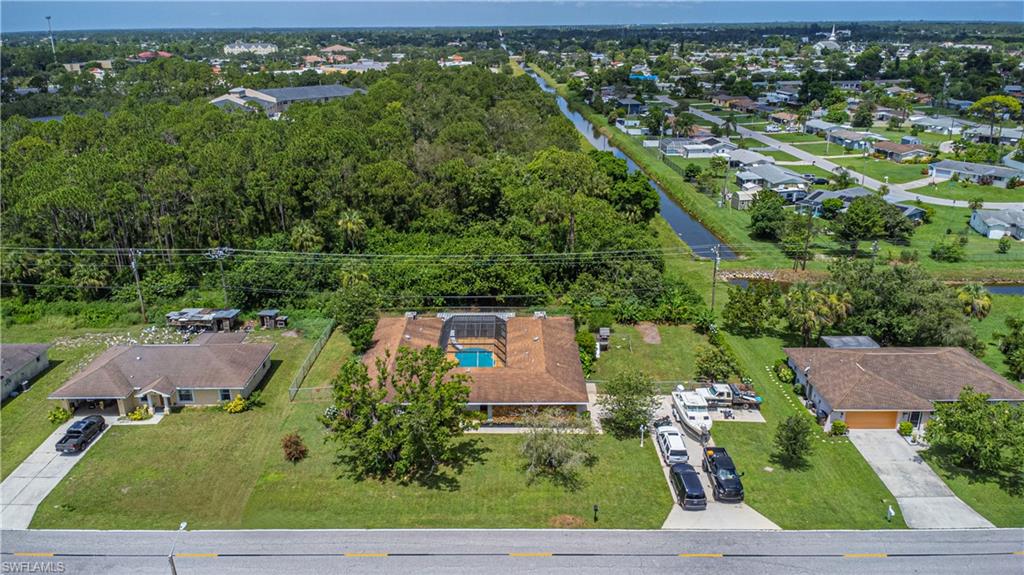 339 Delaware Road Lehigh Acres, FL 33936 - Photo 28 of 30 an aerial view of residential houses with outdoor space and street view