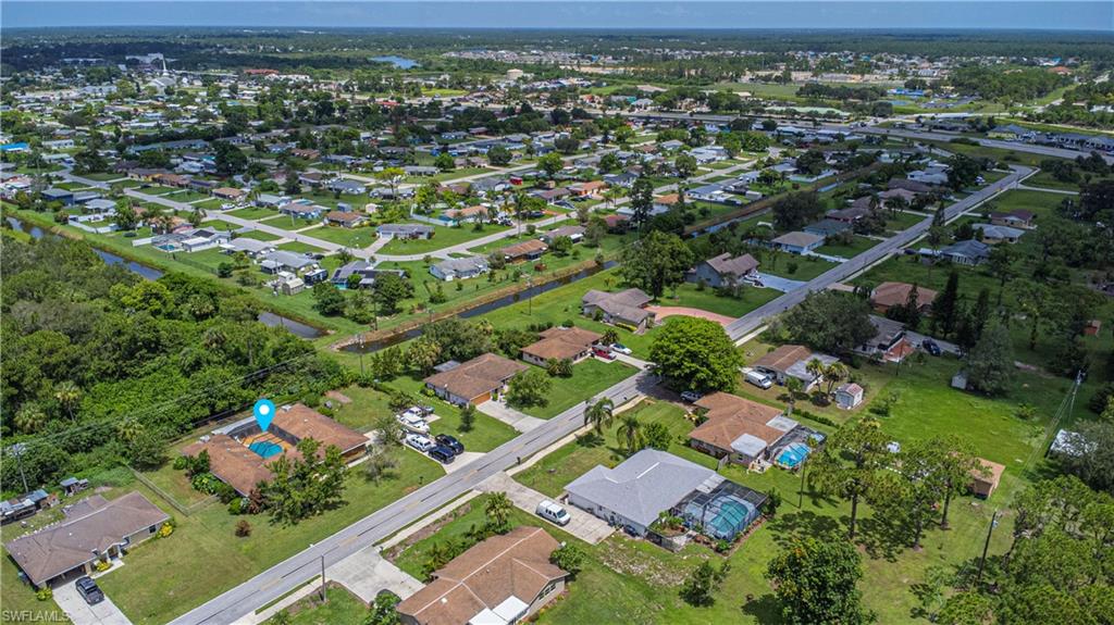 339 Delaware Road Lehigh Acres, FL 33936 - Photo 29 of 30 an aerial view of residential houses with outdoor space
