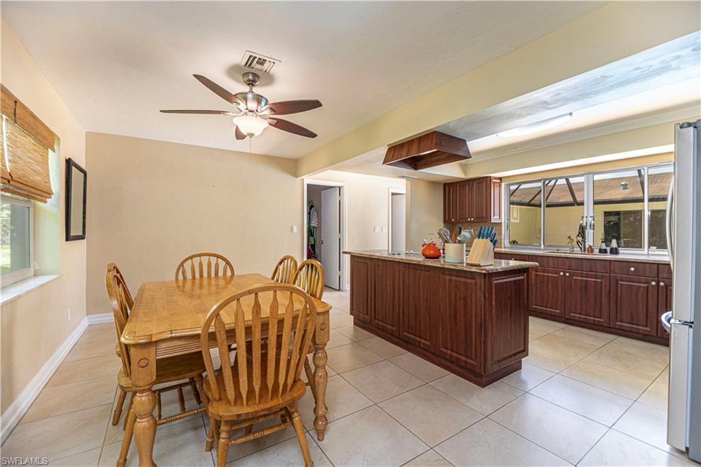 339 Delaware Road Lehigh Acres, FL 33936 - Photo 9 of 30 a view of a dining room with furniture