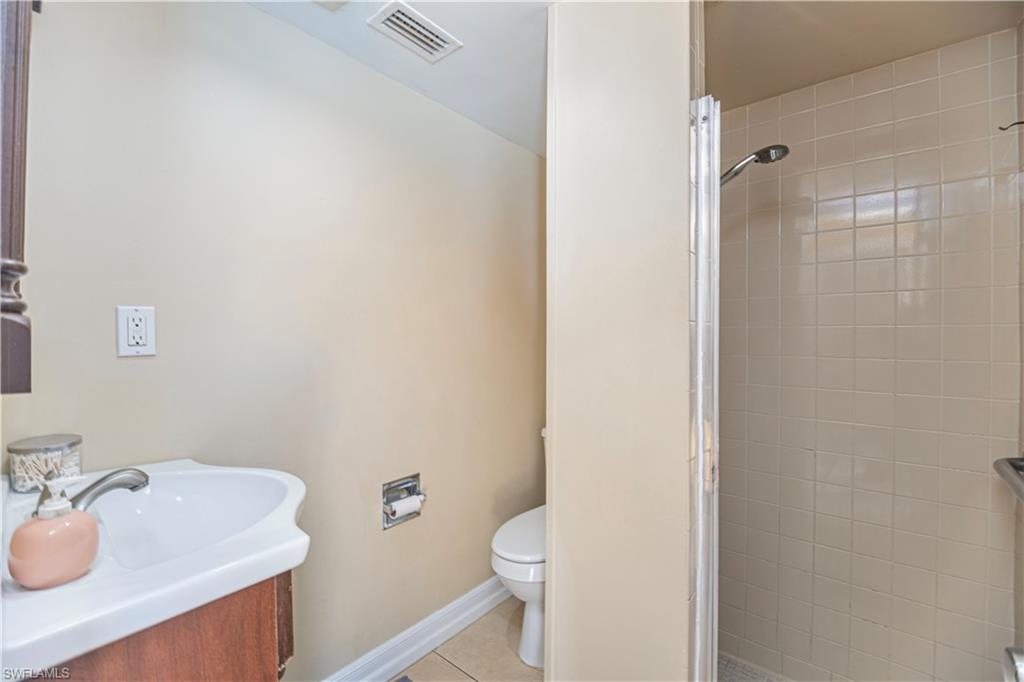 339 Delaware Road Lehigh Acres, FL 33936 - Photo 10 of 30 a bathroom with a sink toilet and vanity