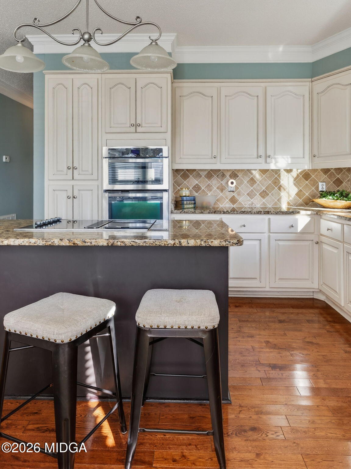 312 Pinnacle Park Macon, GA 31220 - Photo 17 of 63 a kitchen with stainless steel appliances granite countertop a table chairs sink and cabinets