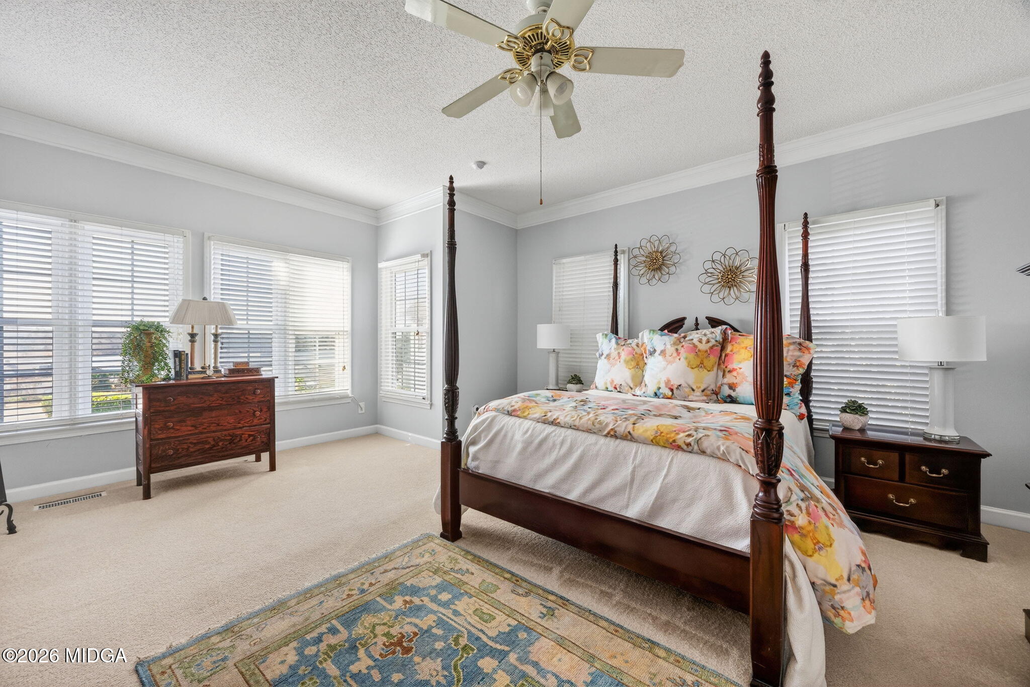 312 Pinnacle Park Macon, GA 31220 - Photo 23 of 63 a bedroom with a bed a dresser and potted plant
