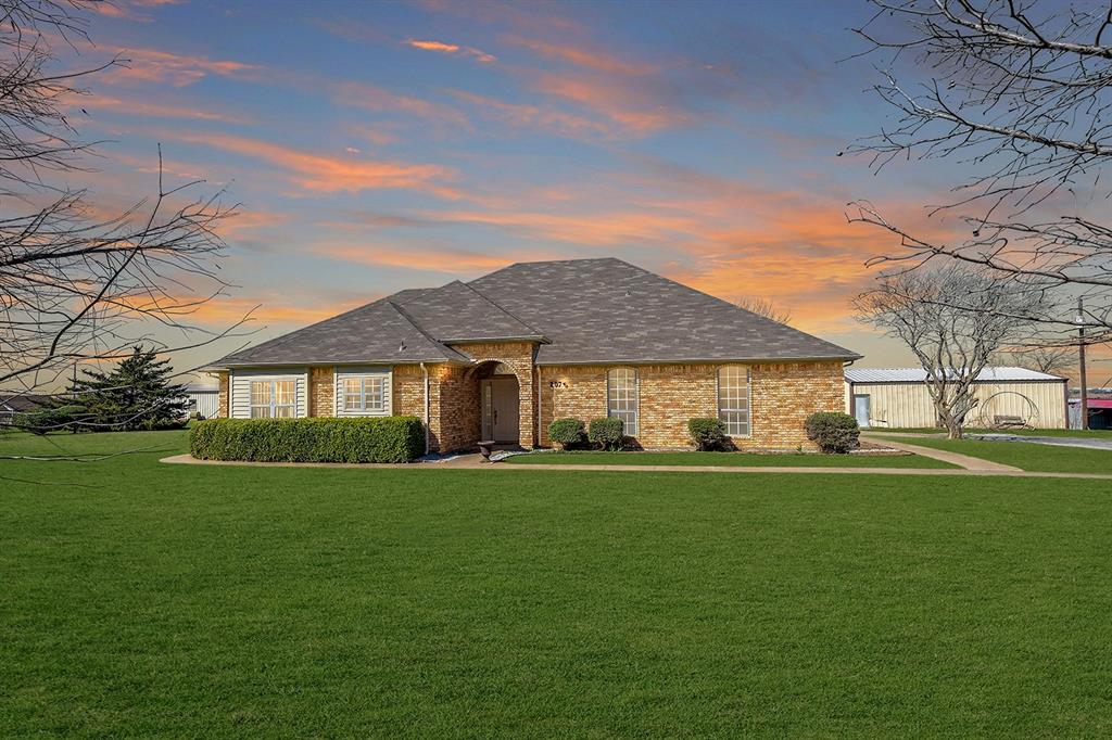 2075 Huling Road Sanger, TX 76266 - Photo 1 of 1 a front view of a house with a garden
