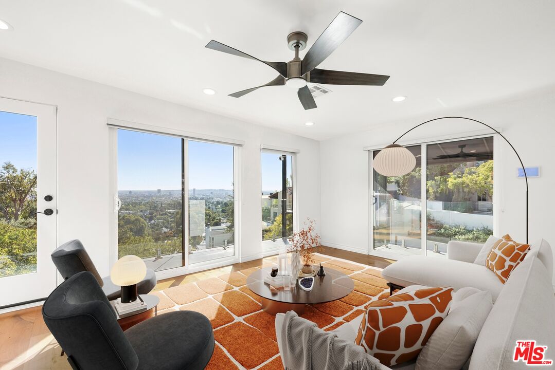 1788 North Orange Grove Avenue Los Angeles, CA 90046 - Photo 1 of 20 a living room with furniture and a large window