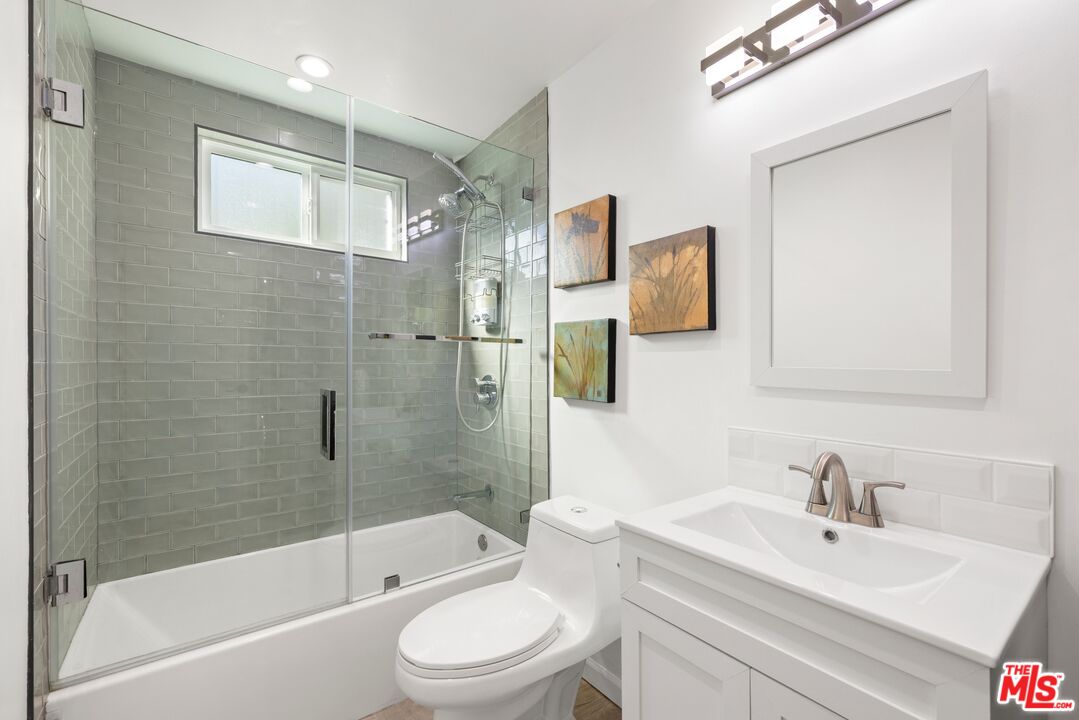 1788 North Orange Grove Avenue Los Angeles, CA 90046 - Photo 13 of 20 a bathroom with a sink toilet and shower