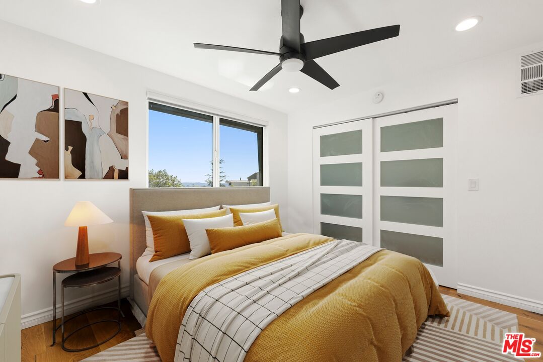 1788 North Orange Grove Avenue Los Angeles, CA 90046 - Photo 16 of 20 a bedroom with a bed and a cabinets