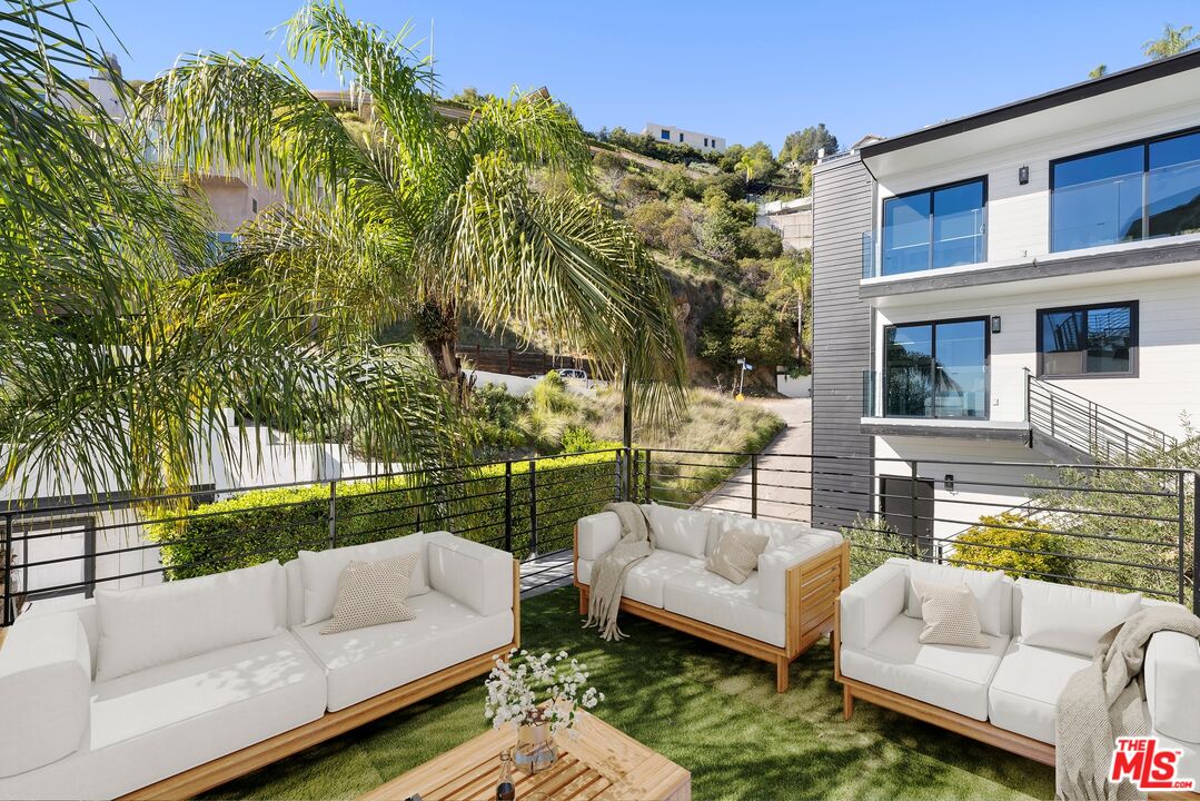 1788 North Orange Grove Avenue Los Angeles, CA 90046 - Photo 19 of 20 a view of a patio with couches and a fire pit