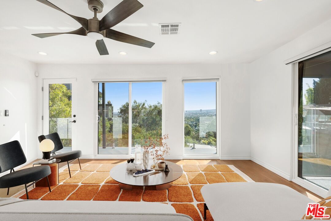 1788 North Orange Grove Avenue Los Angeles, CA 90046 - Photo 2 of 20 a living room with furniture and a large window