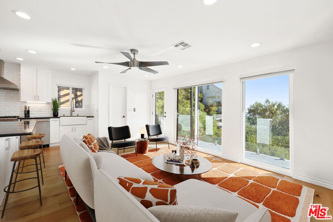1788 North Orange Grove Avenue Los Angeles, CA 90046 - Photo 3 of 20 a living room with furniture and a floor to ceiling window
