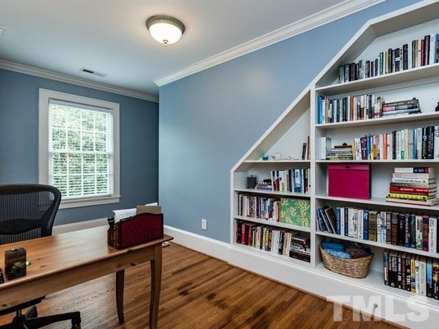 807 Harvey Street Raleigh, NC 27608 - Photo 15 of 24 a living room with lots of books