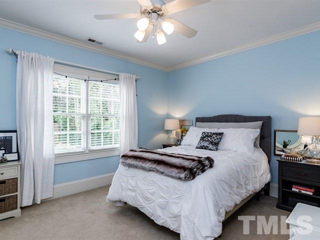 807 Harvey Street Raleigh, NC 27608 - Photo 16 of 24 a bedroom with a bed and a window