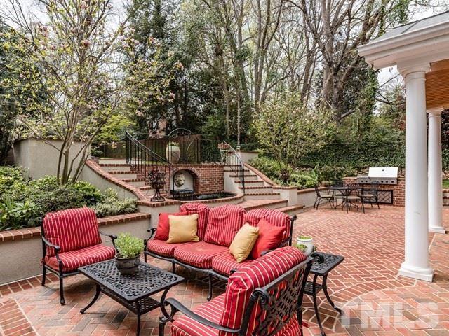 807 Harvey Street Raleigh, NC 27608 - Photo 22 of 24 a outdoor space with patio the couches and a dining table with garden view