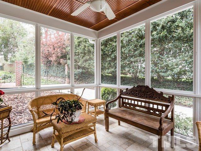 807 Harvey Street Raleigh, NC 27608 - Photo 24 of 24 a living room with furniture and a floor to ceiling window