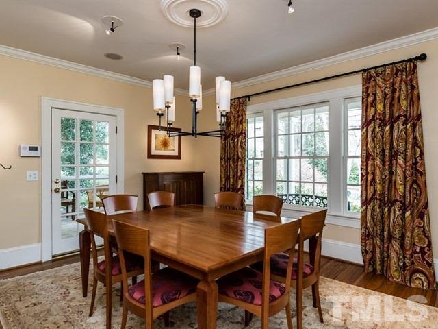 807 Harvey Street Raleigh, NC 27608 - Photo 4 of 24 a view of a dining room with furniture window and outside view