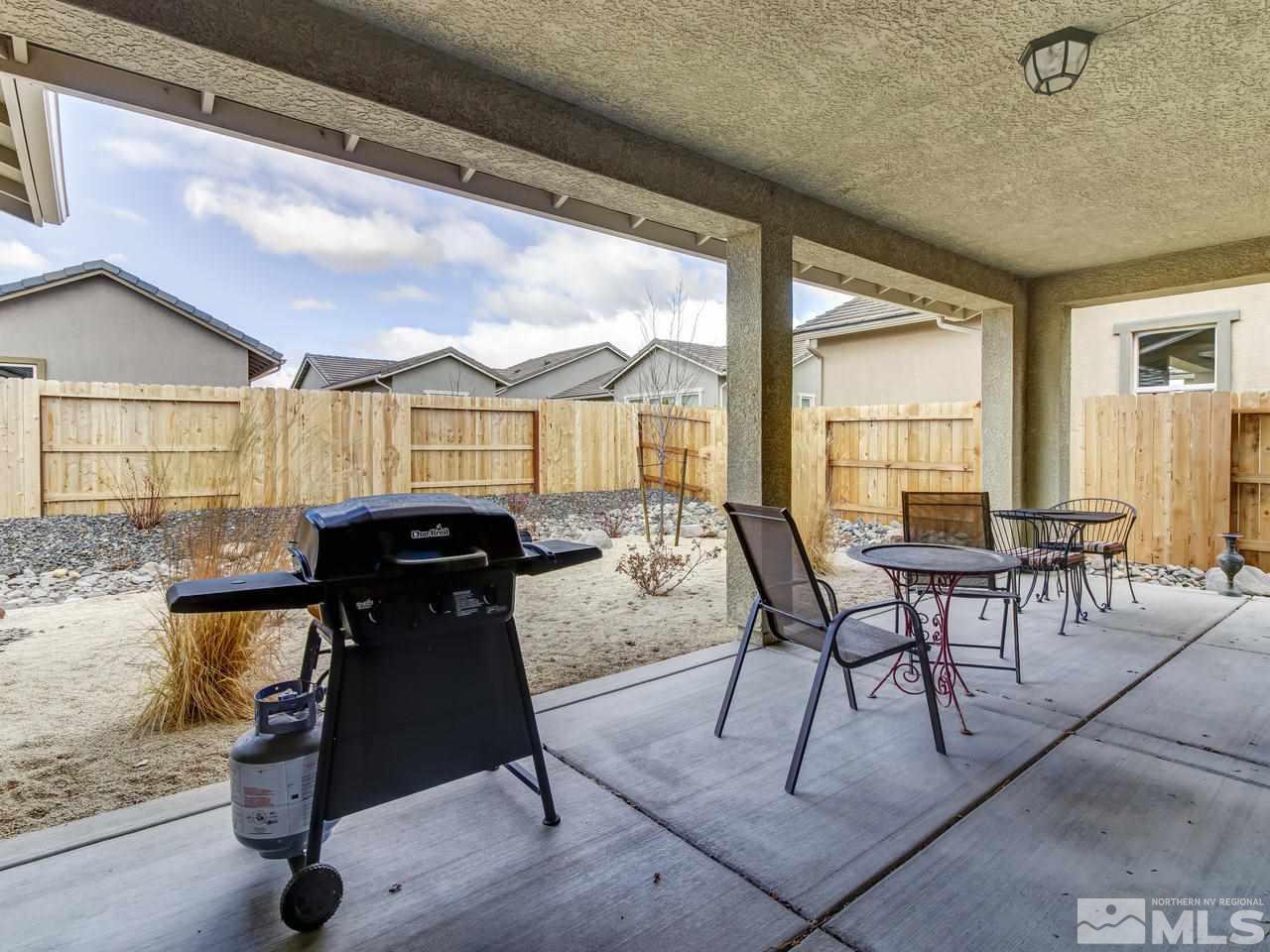 9885 Shadowless Trail Reno, NV 89521 - Photo 24 of 25 a dining room with furniture and a floor to ceiling window