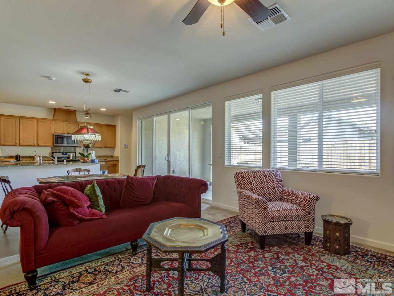 9885 Shadowless Trail Reno, NV 89521 - Photo 10 of 25 a living room with furniture and a large window