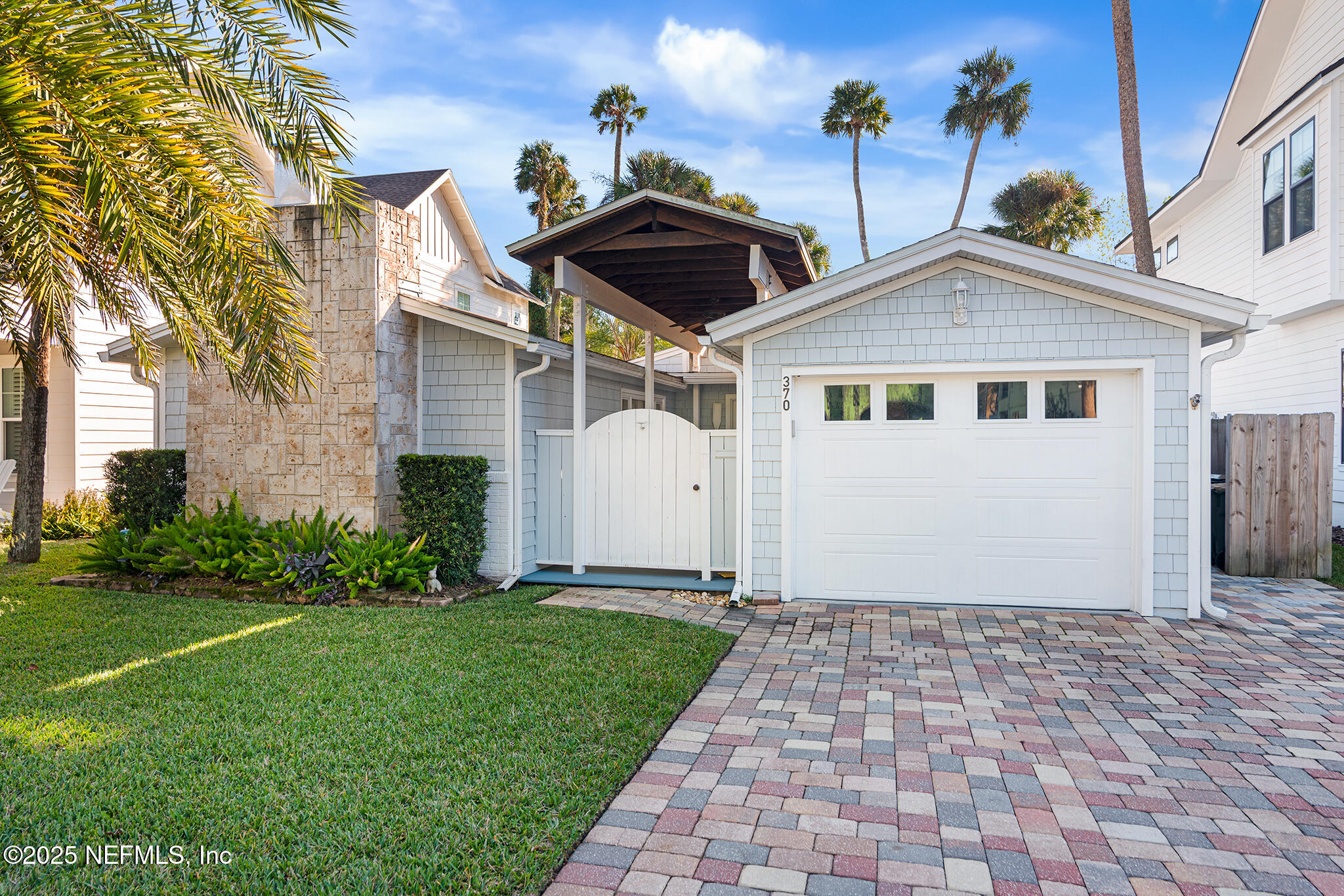 370 10th Street Atlantic Beach, FL 32233 - Photo 1 of 24 a front view of house with yard