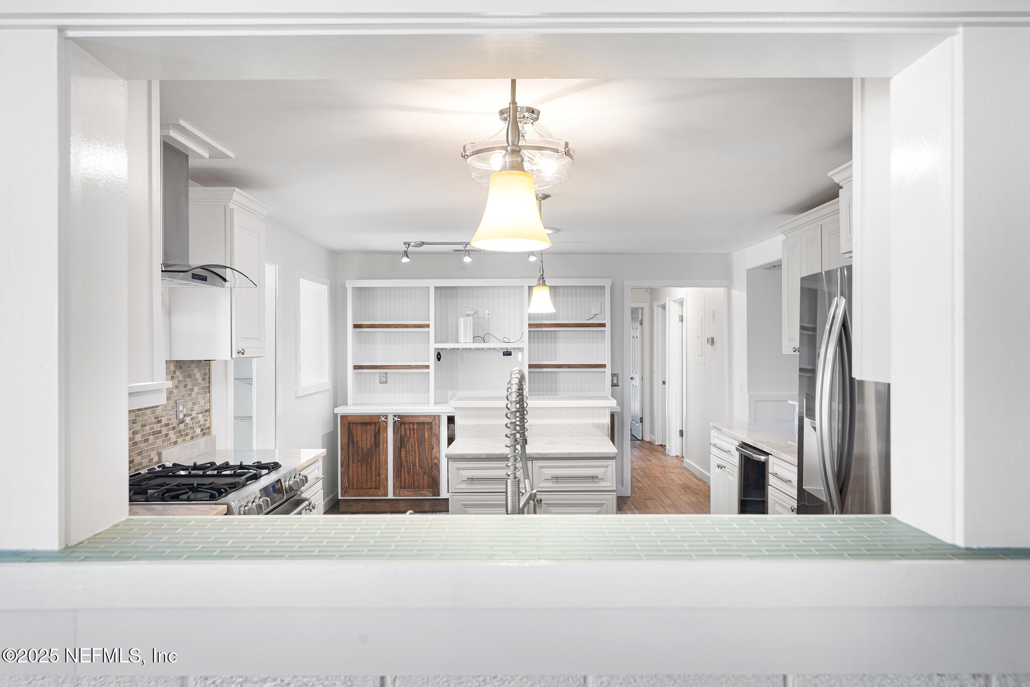 370 10th Street Atlantic Beach, FL 32233 - Photo 11 of 24 a view of a kitchen with wooden floor and windows