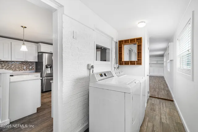 a white refrigerator freezer sitting inside of a kitchen