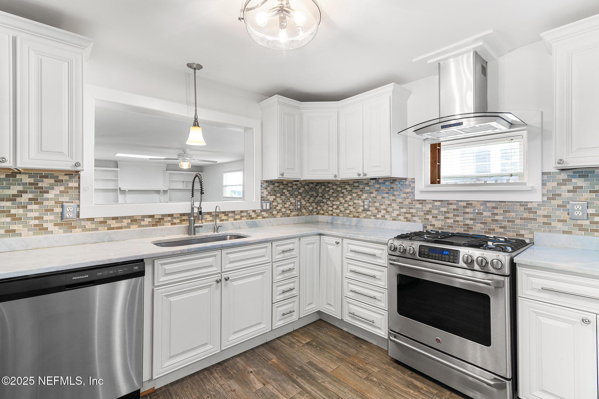 370 10th Street Atlantic Beach, FL 32233 - Photo 2 of 24 a kitchen with cabinets appliances a sink and a window